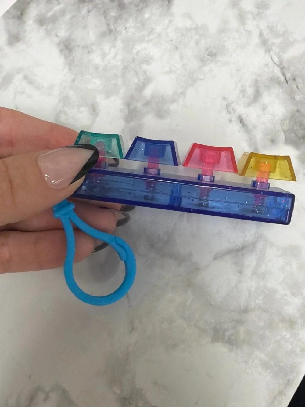 Colorful Mini Keyring Popper Toy - Blue Base with Multicolor Buttons